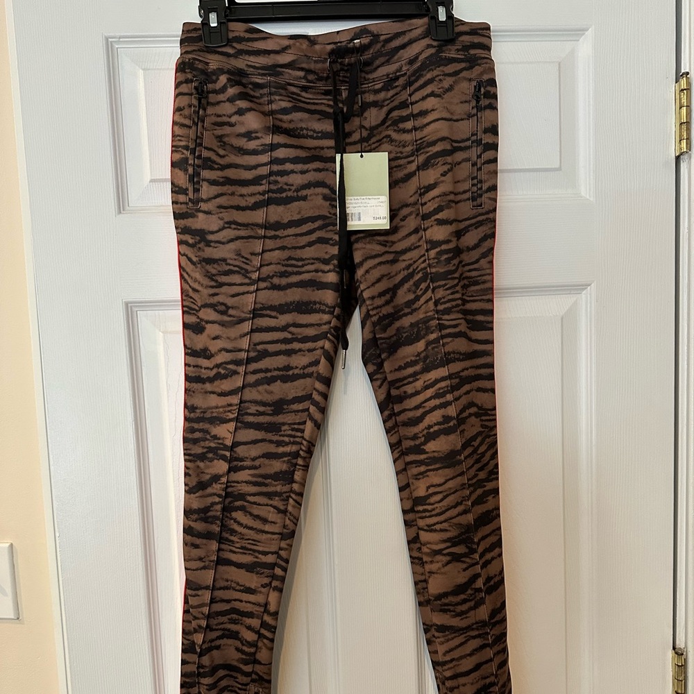 Pam and Gela size small pants with zipper ankle. Never worn with tags
